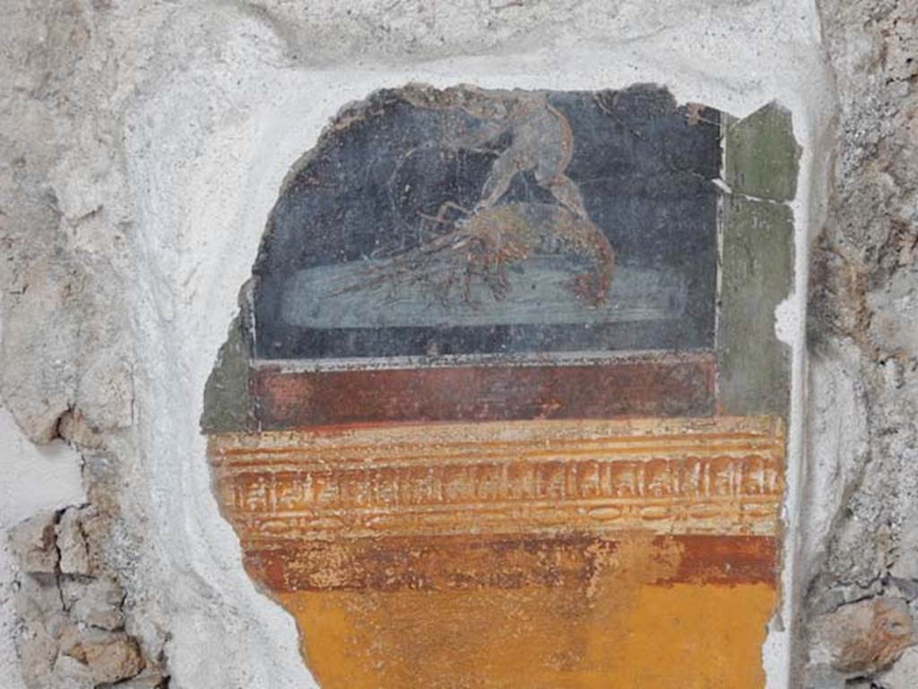 VI.15.1 Pompeii. May 2017.
Detail from painted panel on north end of west wall of atrium, leading onto peristyle. Photo courtesy of Buzz Ferebee.