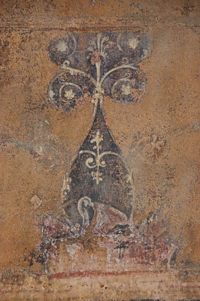 VI.15.1 Pompeii. October 2023.
North wall of atrium, detail from lower centre of yellow panel above site of strongbox. Photo courtesy of Klaus Heese.