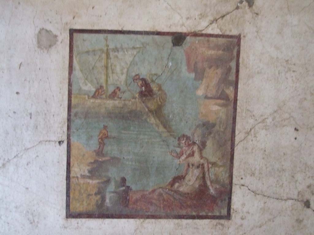 VI.15.1 Pompeii. December 2006.
North wall with painting of Ariadne being abandoned by Theseus. Ariadne is being watched over by a cupid.