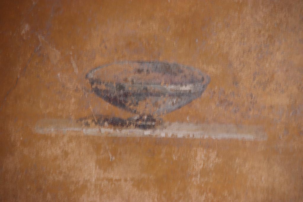 VI.15.1 Pompeii. October 2023.
Cubiculum (d), detail from panel at north end of east wall in north-east corner. Photo courtesy of Klaus Heese.