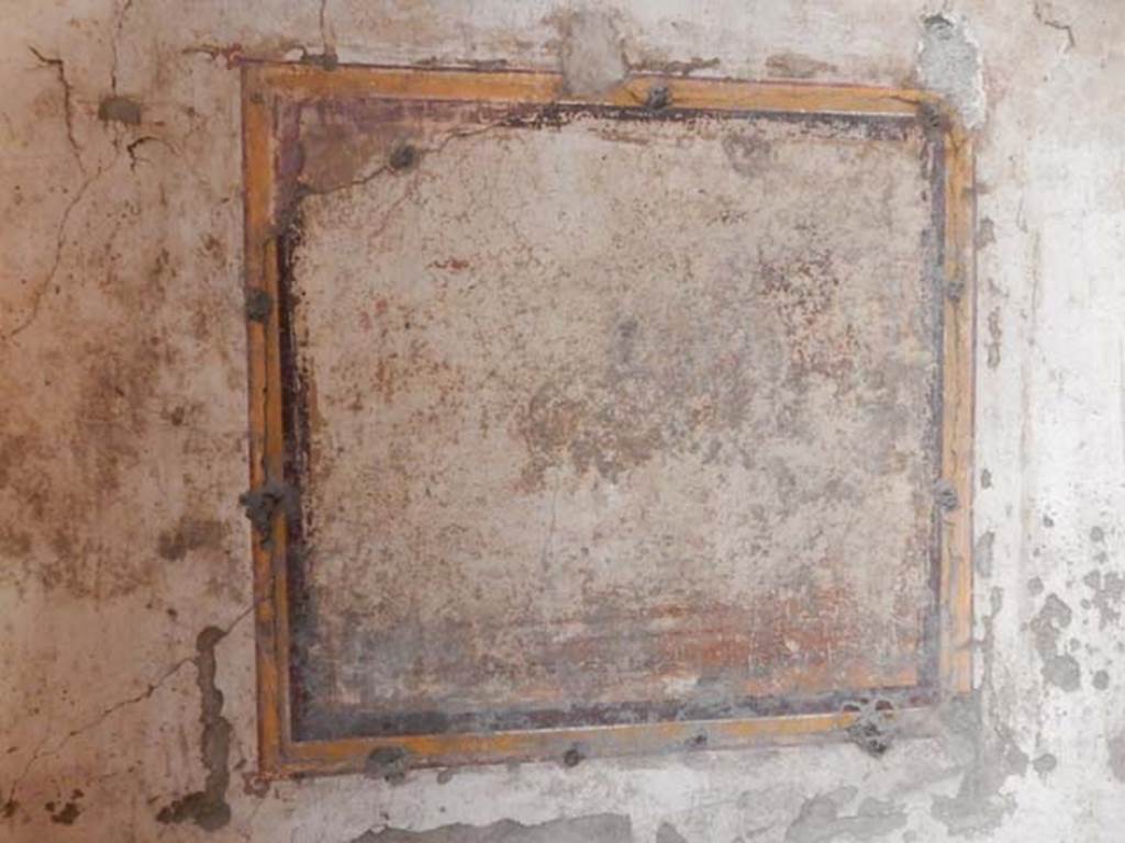 VI.15.1 Pompeii. May 2017. Detail of remains of illegible painting in centre of east wall. Photo courtesy of Buzz Ferebee.