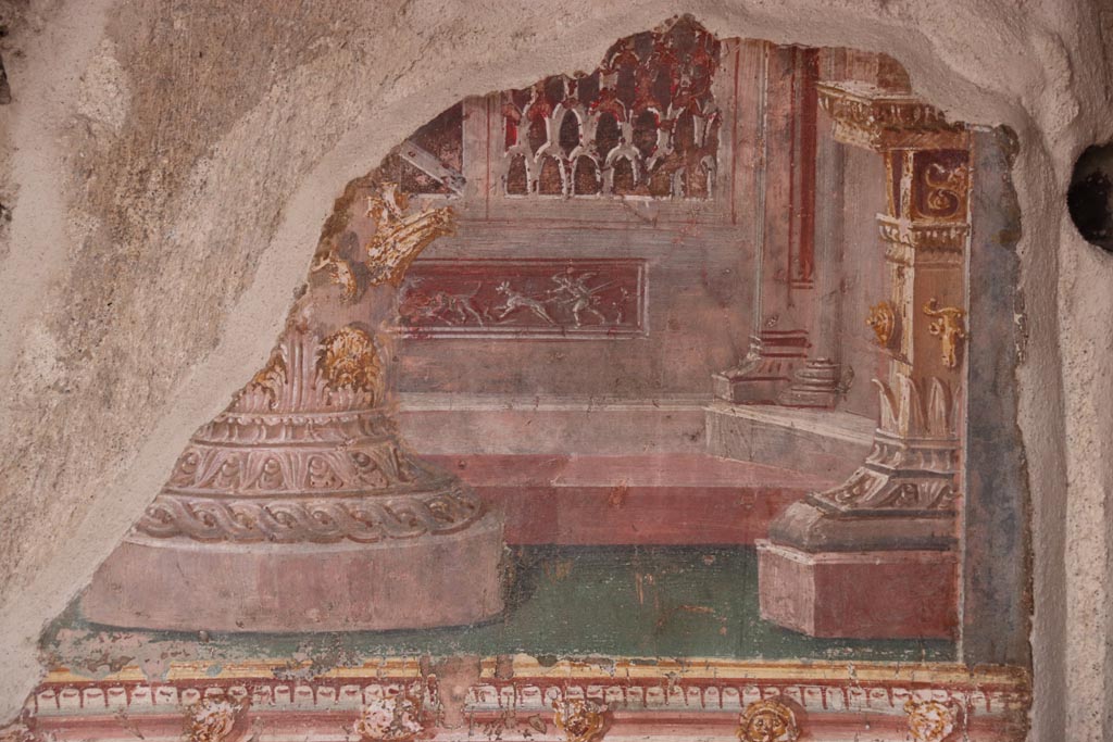 VI.15.1 Pompeii. October 2023.
East wall of atrium, detail of painted decoration from panel between cubiculum (d) and into oecus (e). Photo courtesy of Klaus Heese.