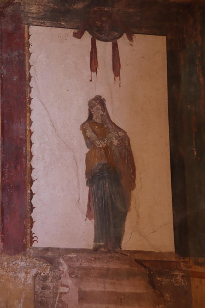 VI.15.1 Pompeii. October 2023.
Detail of painting from upper north wall in north-east corner of oecus. Photo courtesy of Klaus Heese.