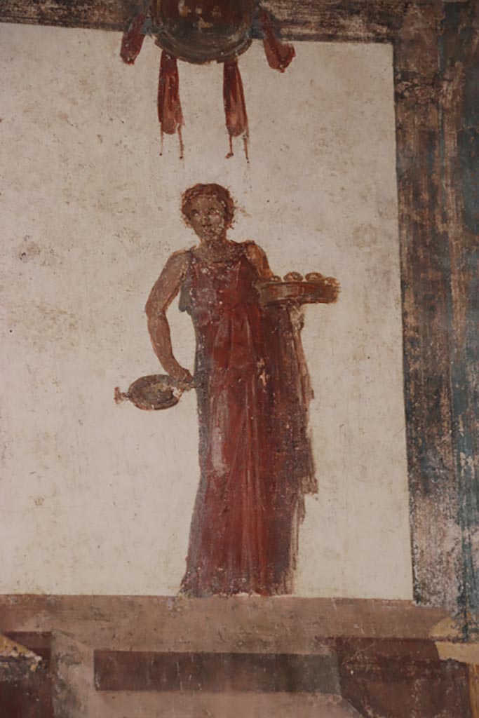 VI.15.1 Pompeii. October 2023.
Detail of painted figure from east wall at south end. Photo courtesy of Klaus Heese.