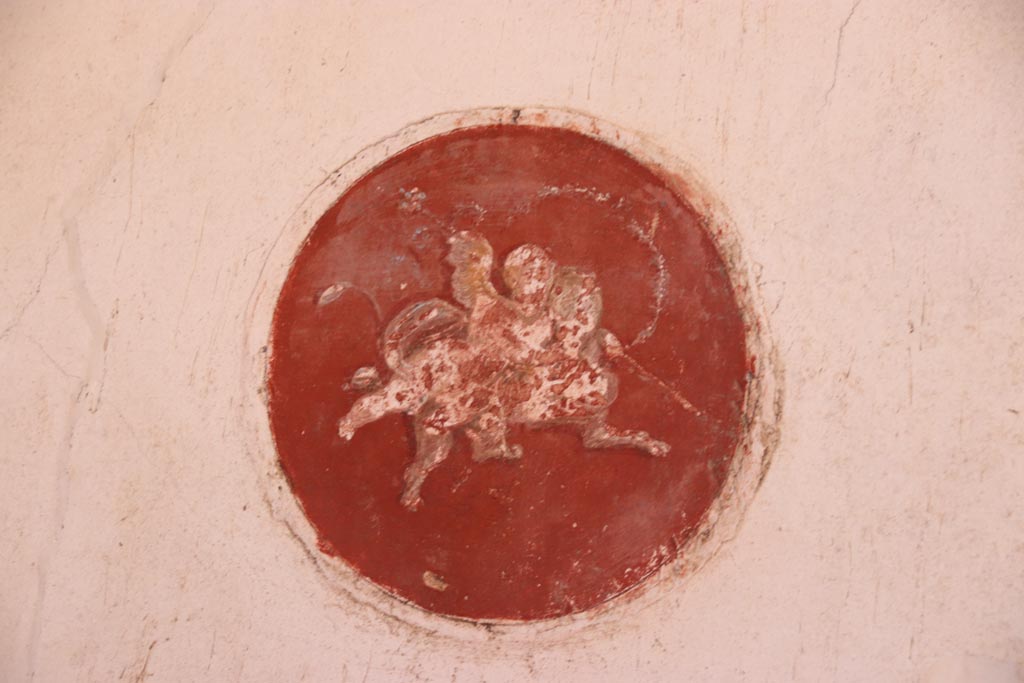 VI.15.1 Pompeii. October 2023. Decorative medallion from west wall of oecus at south end. Photo courtesy of Klaus Heese.