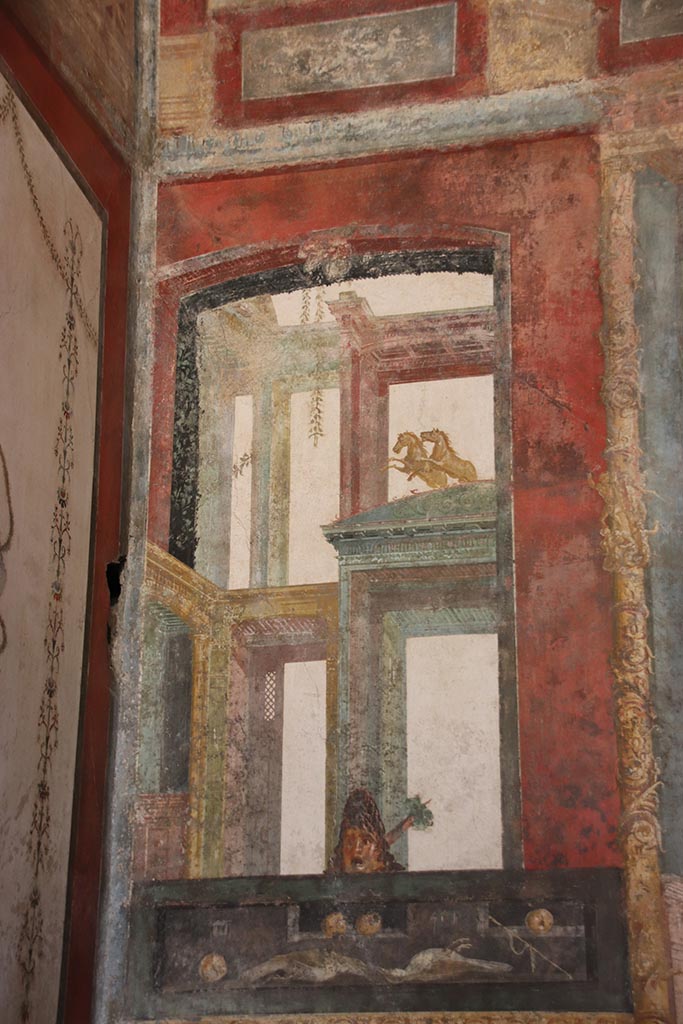 VI.15.1 Pompeii. October 2024.
East wall at north end in exedra, painted panel with food. Photo courtesy of Klaus Heese.