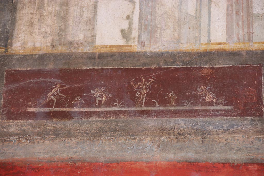 VI.15.1 Pompeii. October 2024.
Upper south wall, detail of painted panel continuing from south-east corner. Photo courtesy of Klaus Heese.