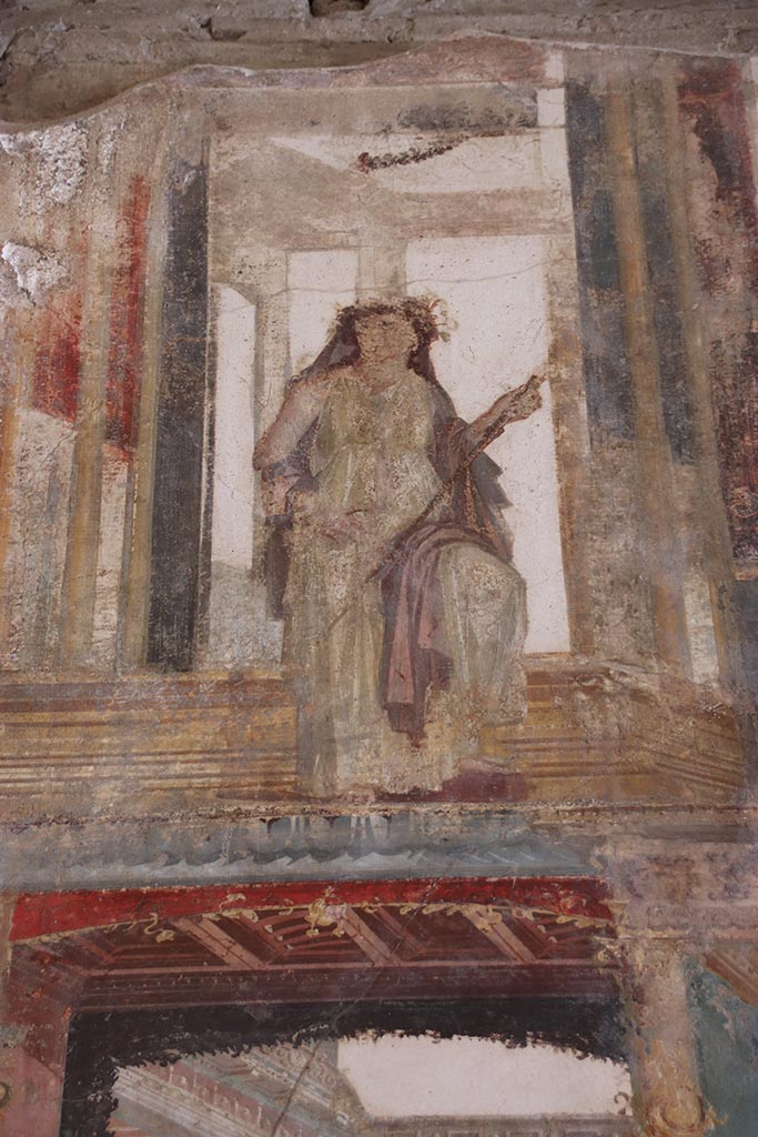 VI.15.1 Pompeii. October 2024.
Upper south wall, detail of painted figure, continuation from south-east corner.
Photo courtesy of Klaus Heese.