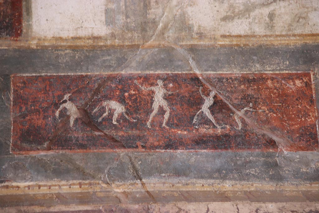 VI.15.1 Pompeii. October 2024.
Upper south wall, detail of painted panel on east side of central figure. Photo courtesy of Klaus Heese.