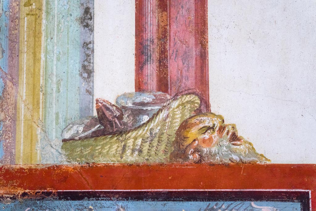 VI.15.1 Pompeii. August 2023. Painted detail from above navel scene on south wall of exedra. Photo courtesy of Johannes Eber.