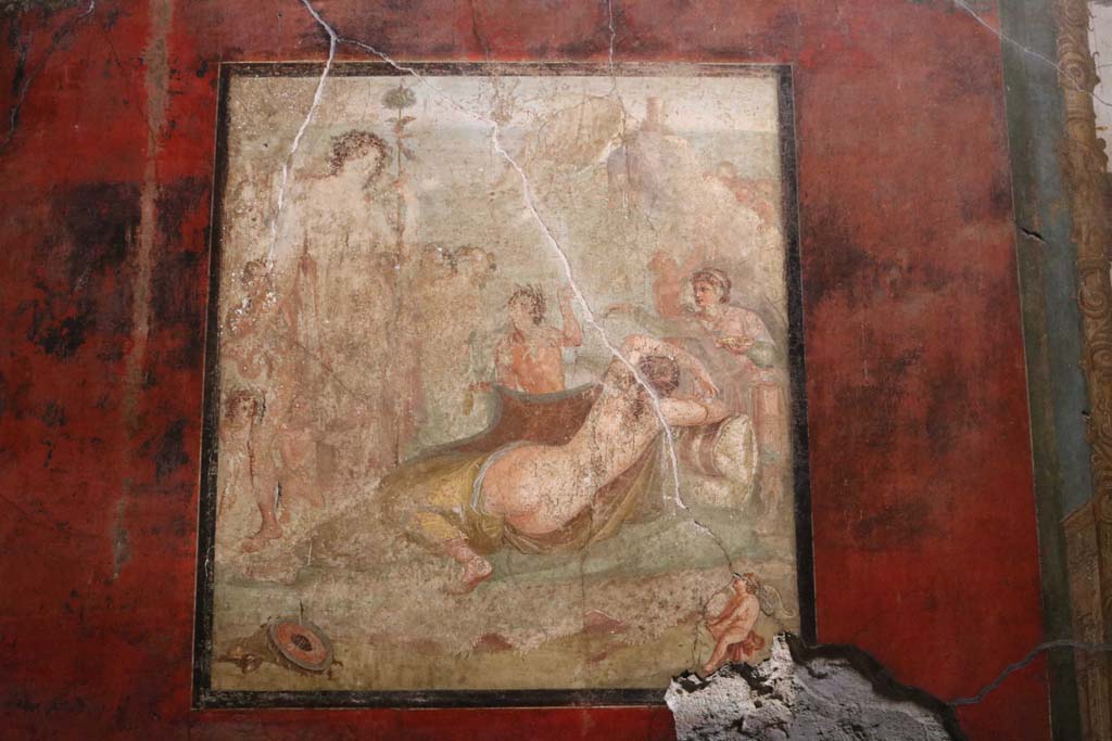 VI.15.1 Pompeii. December 2018.
Central painting from south wall showing Bacchus watching over the sleeping Ariadne after she was abandoned by Theseus.
Photo courtesy of Aude Durand.
Kuivalainen comments –
“The positions and places of the protagonists differ, as do the reactions of the onlookers, otherwise very much as the many other wall paintings depicting this subject. The horizontal line is exceptionally high.”
See Kuivalainen, I., 2021. The Portrayal of Pompeian Bacchus. Commentationes Humanarum Litterarum 140. Helsinki: Finnish Society of Sciences and Letters, (p.147, E9).