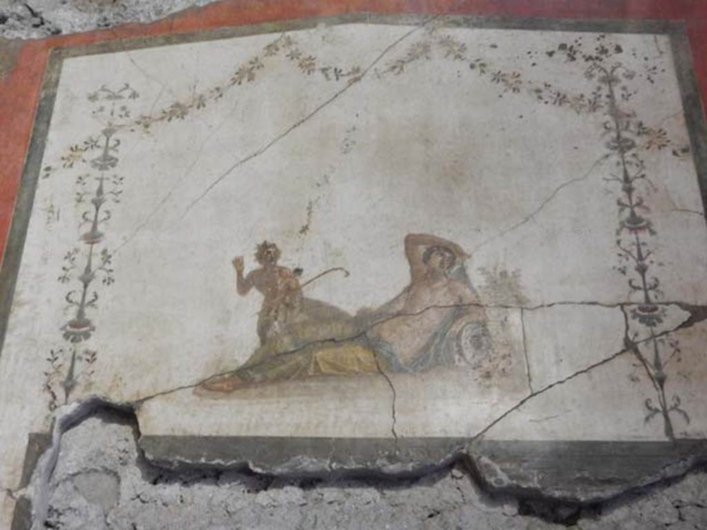 VI.15.1 Pompeii. May 2017. Detail of panel above door in south wall showing Pan discovering Hermaphrodite. Photo courtesy of Buzz Ferebee.