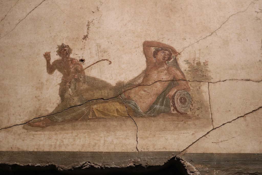 VI.15.1 Pompeii. December 2018.
Detail of panel showing Pan discovering Hermaphrodite from above door in south wall. Photo courtesy of Aude Durand.