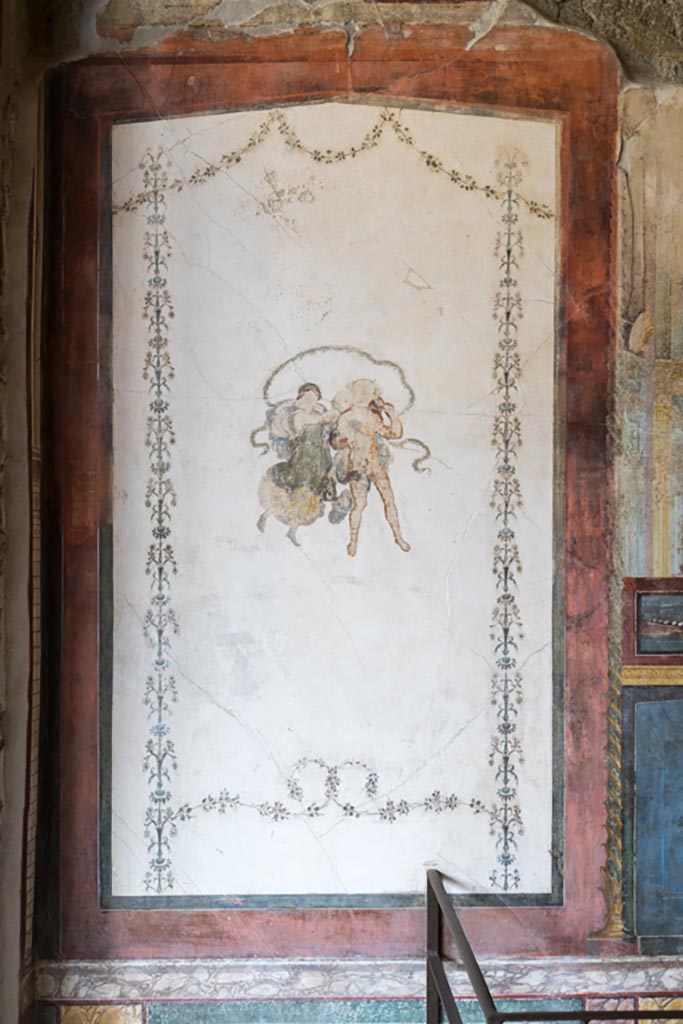 VI.15.1 Pompeii. March 2023.
Painted panel at west end of north wall of exedra. Photo courtesy of Johannes Eber.