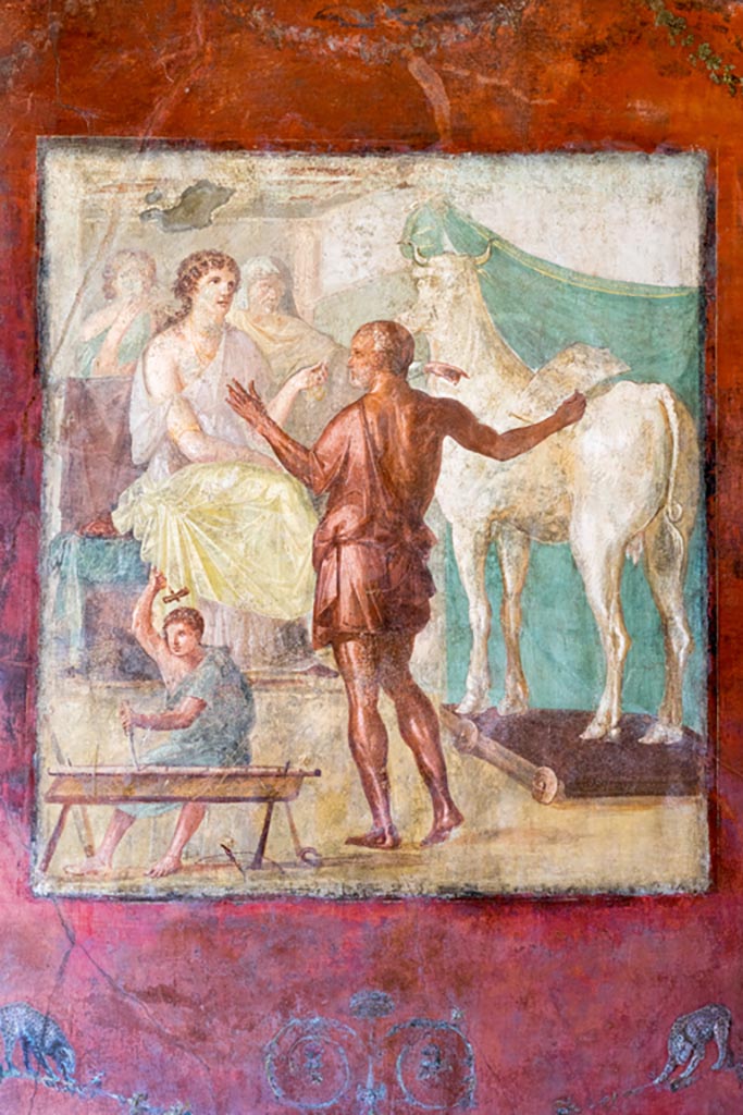 VI.15.1 Pompeii. March 2023.
Central painting of Daedalus showing Pasiphae the wooden cow, from centre of north wall of exedra.
Photo courtesy of Johannes Eber.