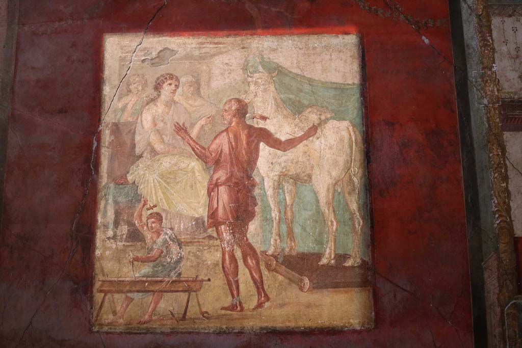 VI.15.1 Pompeii. December 2018.
North wall of exedra, central wall painting of Daedalus showing Pasiphae the wooden cow. Photo courtesy of Aude Durand.