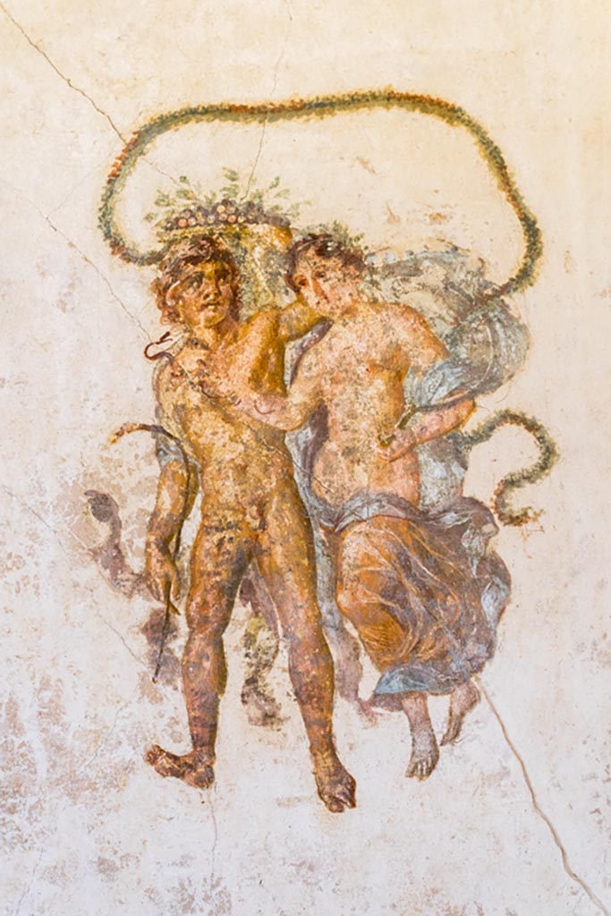 VI.15.1 Pompeii. March 2023.
East end of north wall of exedra, with detail of painting of two floating figures.
Photo courtesy of Johannes Eber.