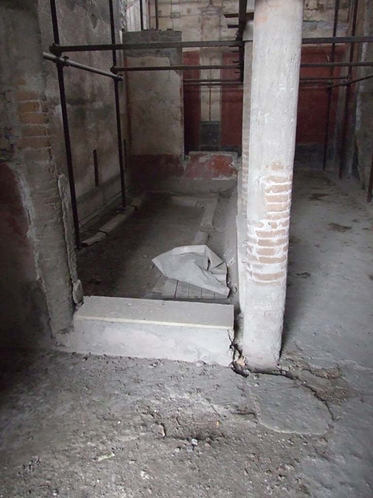 VI.15.1 Pompeii. December 2006. Gynaeceum, small courtyard “s”, looking north.
According to Jashemski, this small peristyle garden had a portico on its east side supported by five pillars.
The gutter around the edges of the garden carried the roof water to the cistern mouth in the south-east corner, (under the wood and white bag in the photo).
See Jashemski, W. F., 1993. The Gardens of Pompeii, Volume II: Appendices. New York: Caratzas. (p.155).