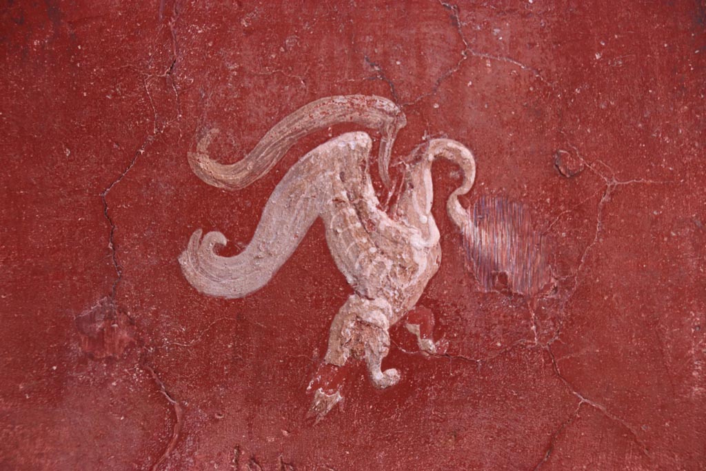 VI.15.1 Pompeii. October 2023.
Small peristyle/garden “s”, detail from centre of south red panel in west wall at north end. Photo courtesy of Klaus Heese.