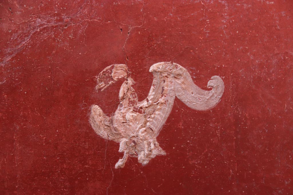 VI.15.1 Pompeii. October 2023.
Small peristyle/garden “s”, detail from centre of north red panel in west wall at north end. Photo courtesy of Klaus Heese.