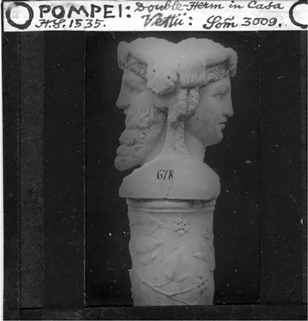 VI.15.1 Pompeii. Double bust of Dionysus and Ariadne at the top of a herm.
c.1900 glass slide of a Sommer photo no. 3009. The painted inventory number on the side of the bust is 678. Photo courtesy of Alan Lindfield.