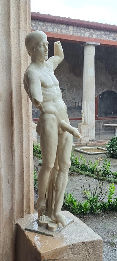 VI.15.1 Pompeii. January 2023. 
Statue of Priapus on east side of peristyle. Photo courtesy of Miriam Colomer.
