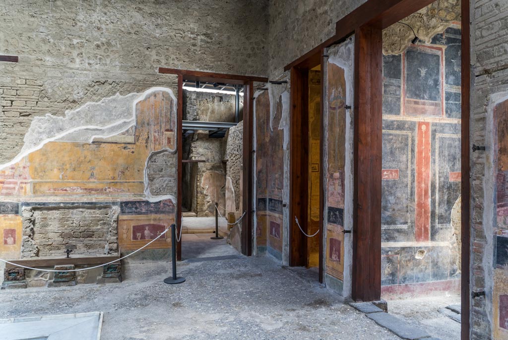 VI.15.1 Pompeii. March 2023. 
Looking north along east end of atrium from entrance vestibule, on right. Photo courtesy of Johannes Eber.