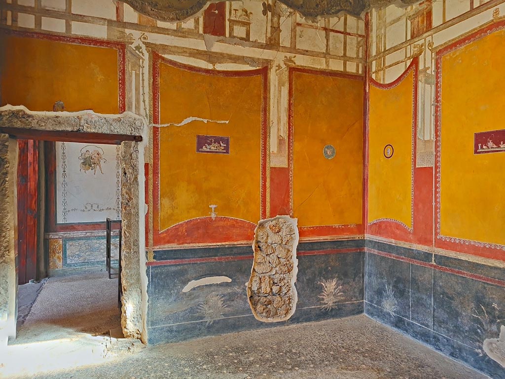 VI.15.1 Pompeii. April 2023. 
Looking north towards wall with doorway into north exedra (room p), and north-east corner, on right. Photo courtesy of Giuseppe Ciaramella.