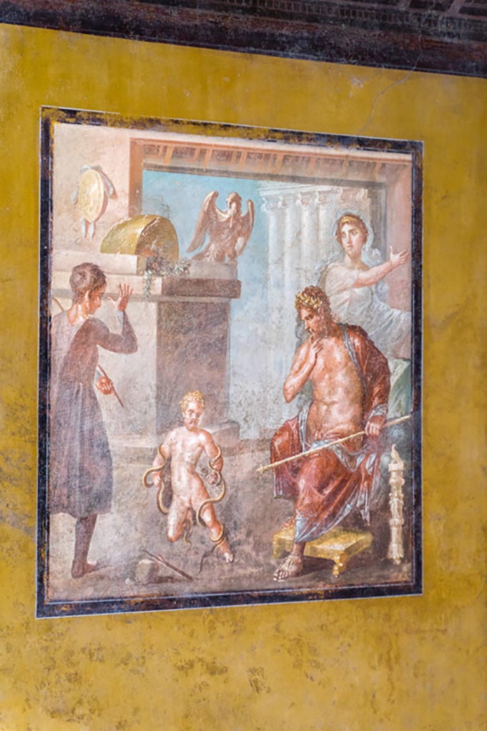 VI.15.1 Pompeii. March 2023. 
Central painting from north wall of exedra - Hercules strangling the serpents.
Photo courtesy of Johannes Eber.