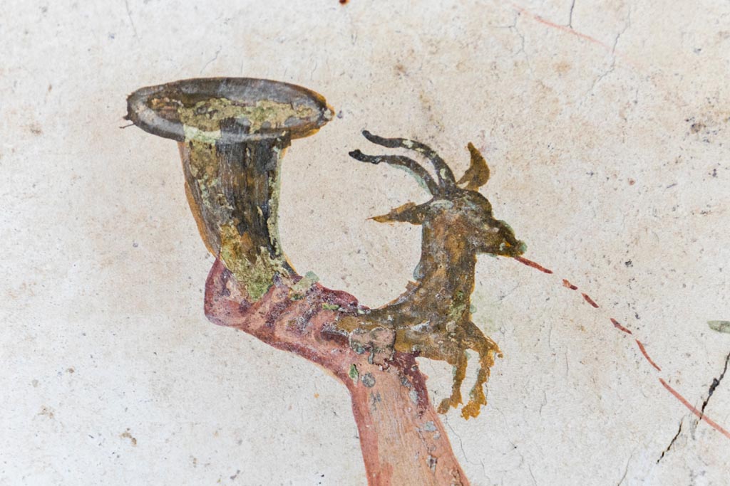 VI.15.1 Pompeii. August 2023.
Detail from lararium painting of painted rhyton, from north end of lararium painting. Photo courtesy of Johannes Eber.