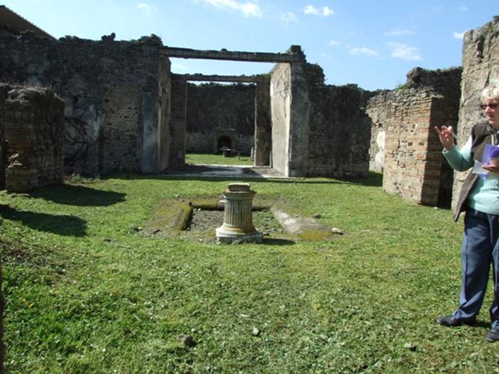 VI.15.5 Pompeii. March 2009. Room 1, looking west across atrium.  According to NdS, the tuscan atrium was spacious, with an impluvium of tufo in the middle. The flooring was littered with small pieces of coloured marble. The walls were devoid of any decoration and that this house was undergoing restoration was demonstrated by the building materials found here and there. Found in the atrium were two bronze seals, one with the name Titiniae Saturni, and Sogliano could read L. Sepun(i) Symphron(is) on the other. Another bronze seal was found in a cubiculum on the north side of the atrium, it read - C. Stlacci Epitynchan(i)
See Notizie degli Scavi, January 1897, (p.22)