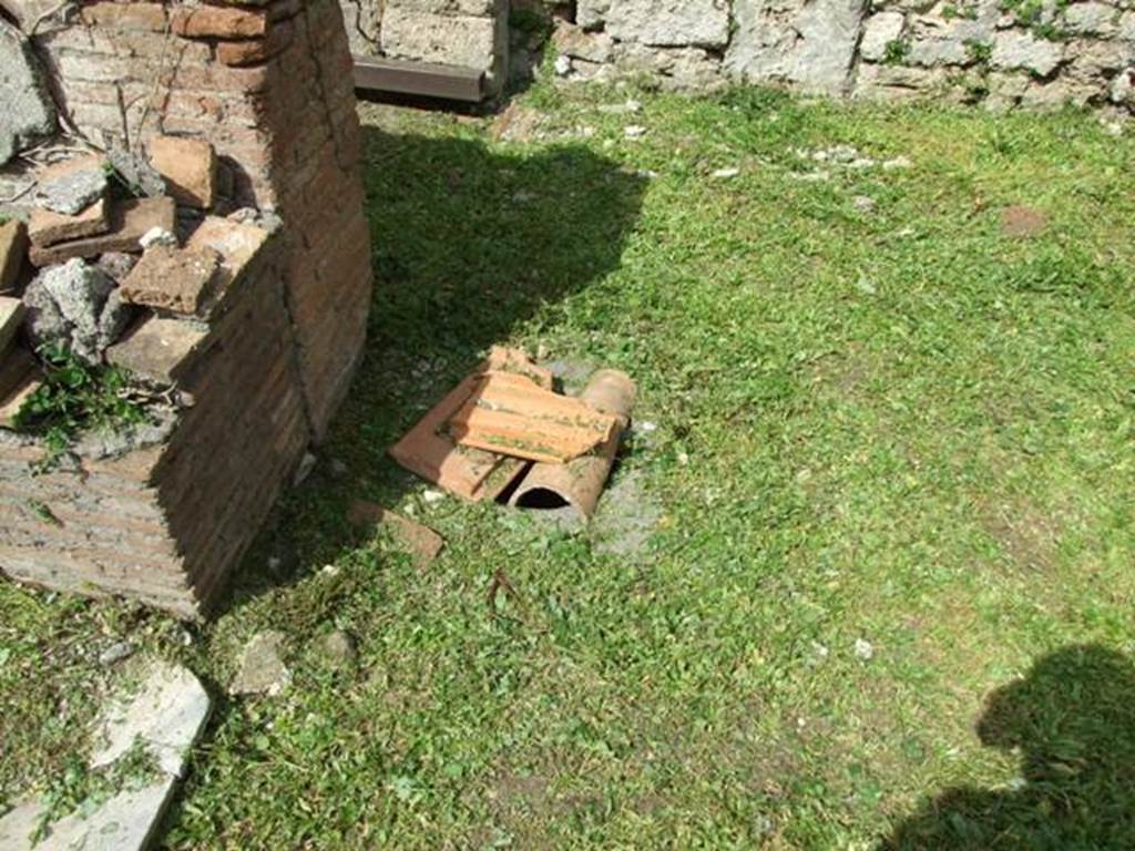 VI.15.6 Pompeii. March 2009.  Room 1, north-west corner of atrium, outside north side of tablinum. According to NdS, at the foot of the pilaster dividing the entrance of the tablinum and the corridor, a cistern-mouth opened in the floor of the atrium.