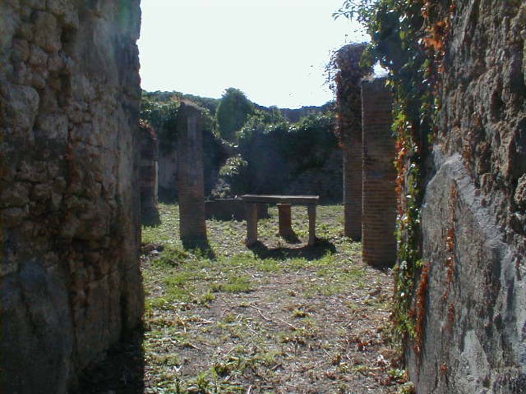 VI.15.6 Pompeii. September 2004. Looking west across atrium, from entrance fauces.  
According to NdS, two bronze signet/seals were dug up in the atrium.
One had the name A. Caesi Valentis, and on the other was N. Herenni Nardi.
See Notizie degli Scavi di Antichità, January 1897, (p.30)