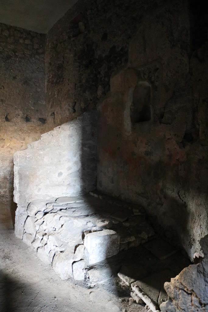 VI.15.8 Pompeii. December 2018. 
Looking towards north-west corner of kitchen with hearth, and niche above in north wall.
Photo courtesy of Aude Durand.