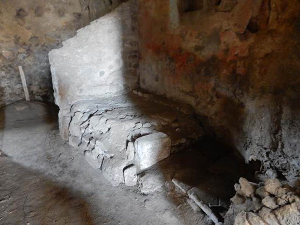VI.15.8 Pompeii. May 2015. Hearth or bench in north-west corner of kitchen.  Photo courtesy of Buzz Ferebee.
