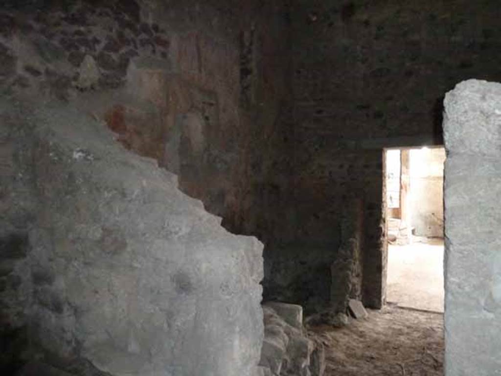 VI.15.8 Pompeii. May 2010. Looking east across north side of kitchen towards atrium.