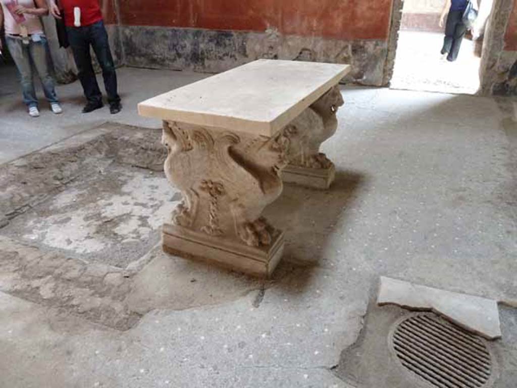 VI.15.8 Pompeii. May 2010. Marble table in atrium, looking south from north end.