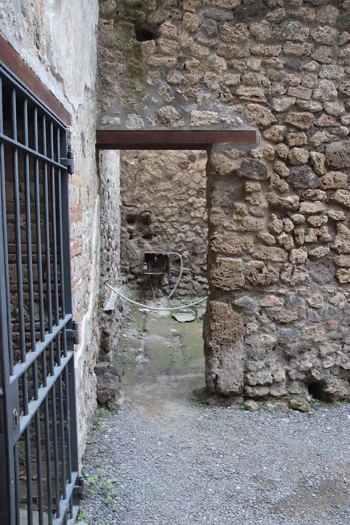 VI.15.27 Pompeii. October 2023. 
Looking east towards doorway into stable. Photo courtesy of Klaus Heese.