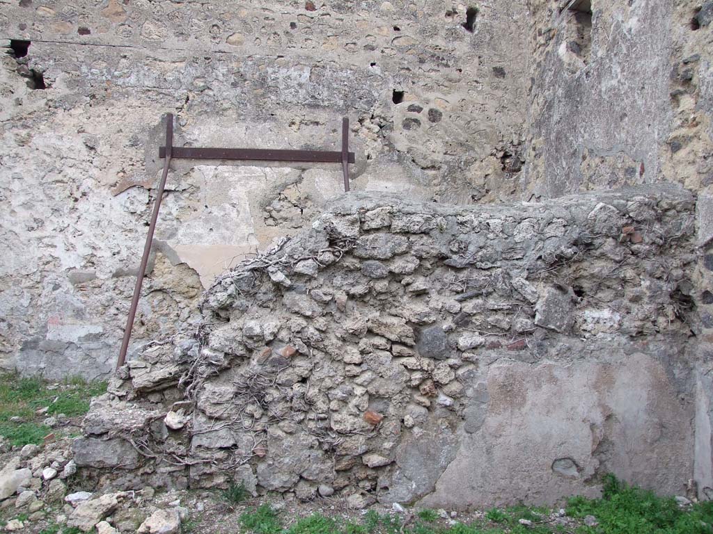 VI.16.2 Pompeii. December 2007. Looking north at rear wall of bar-room.
According to Sogliano, this wall had a doorway leading into the rear room, on the left. The wall also had a window towards the right.
See Notizie degli Scavi di Antichità, 1906, (p.346).