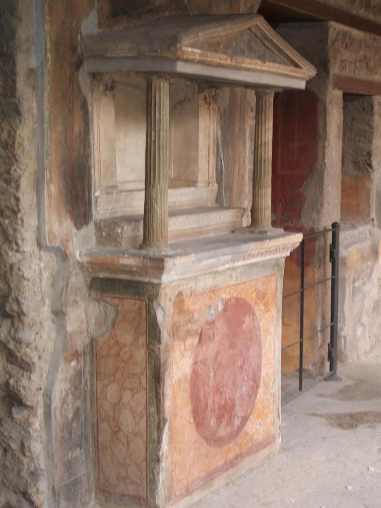 VI.16.7 Pompeii. May 2006. Room F, north portico. Lararium with aedicula over altar to household gods.
See Boyce G. K., 1937. Corpus of the Lararia of Pompeii. Rome: MAAR 14, pp. 57-8, no. 221 and pl.38, 2
See Giacobello, F., 2008. Larari Pompeiani: Iconografia e culto dei Lari in ambito domestico.  Milano: LED Edizioni. (p.277).