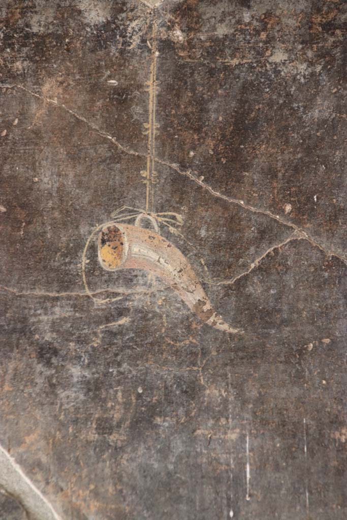 VI.16.7 Pompeii. September 2021. 
Peristyle F, detail from east wall of east portico at the southern end left of the lararium.
Photo courtesy of Klaus Heese.