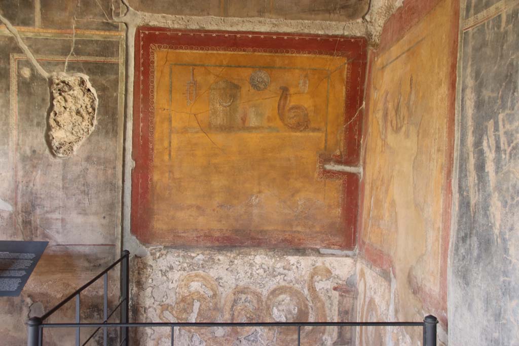 VI.16.7 Pompeii. September 2021. 
Room F, looking east from south portico towards lararium in south-east corner of peristyle. Photo courtesy of Klaus Heese.