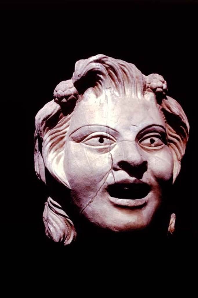 VI.16.7 Pompeii, 1978. Marble mask of a youthful satyr. Photo by Stanley A. Jashemski.   
Source: The Wilhelmina and Stanley A. Jashemski archive in the University of Maryland Library, Special Collections (See collection page) and made available under the Creative Commons Attribution-Non Commercial License v.4. See Licence and use details. J78f0587
According to Wilhelmina, this youthful satyr had two clusters of ivy flowers in his hair, with his mouth somewhat open and pupils bored, with traces of colour,
(0.26m high: Pompeii inv. no: 2866).
See Jashemski, W. F., 1979. The Gardens of Pompeii. New York: Caratzas. (p.40, fig.65)
See Jashemski, W. F., 1993. The Gardens of Pompeii, Volume II: Appendices. New York: Caratzas. (p.162)