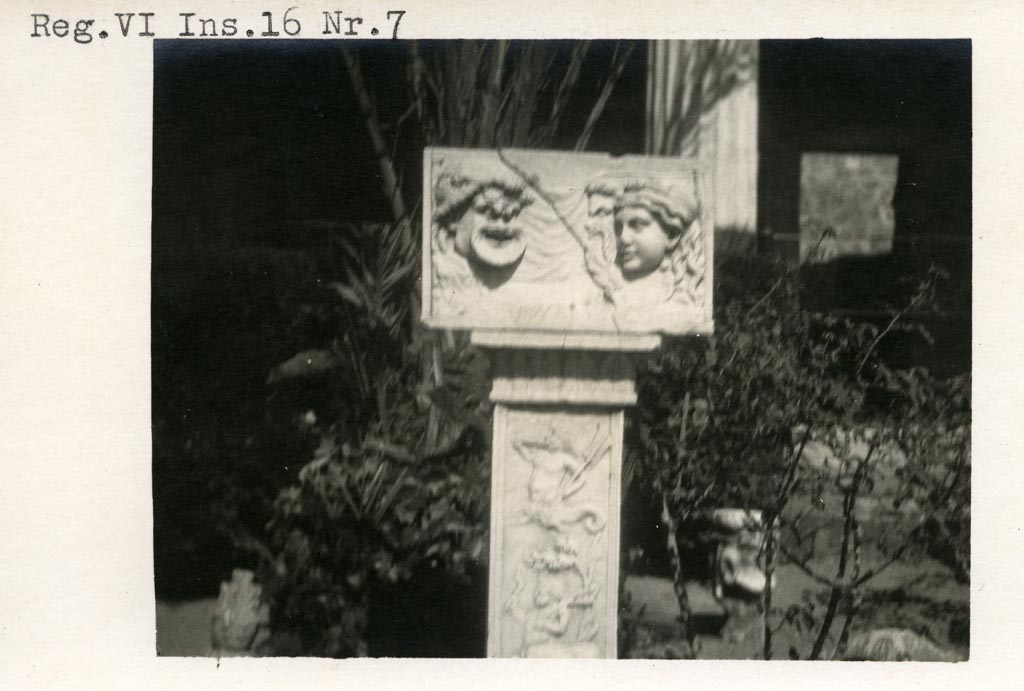 VI.16.7 Pompeii. Pre-1937-39. Marble relief with masks on a pilaster in peristyle garden
Photo courtesy of American Academy in Rome, Photographic Archive. Warsher collection no. 494.