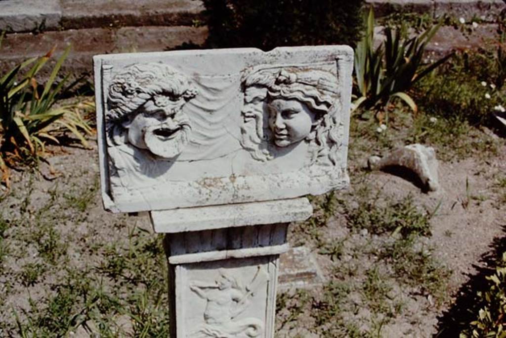 VI.16.7 Pompeii, 1968. Marble relief with masks on a pilaster in peristyle garden room F.  Photo by Stanley A. Jashemski.
Source: The Wilhelmina and Stanley A. Jashemski archive in the University of Maryland Library, Special Collections (See collection page) and made available under the Creative Commons Attribution-Non Commercial License v.4. See Licence and use details. J68f0200