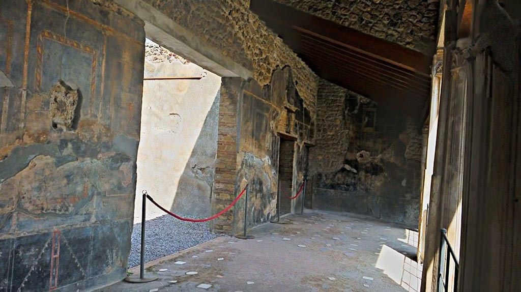 VI.16.7 Pompeii. 2015/2016. 
Looking north along west portico towards doorway to large triclinium O, in the centre of the west side. Photo courtesy of Giuseppe Ciaramella.