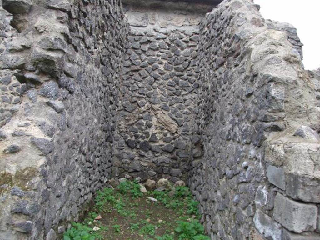 VI.16.8 Pompeii. December 2007. Looking west towards site of staircase to upper floor.
According to NdS, the small entrance room contained the first section of the staircase with five masonry steps. At the top of the masonry steps was a staircase landing in wood supported by the beams.  Above the landing, wooden stairs continued to the upper floor.
At the foot of the stairs was the circular mouth of a terracotta cistern. Found under the landing was a deposit of amphorae. See Notizie degli Scavi di Antichità, 1908, (p.54)