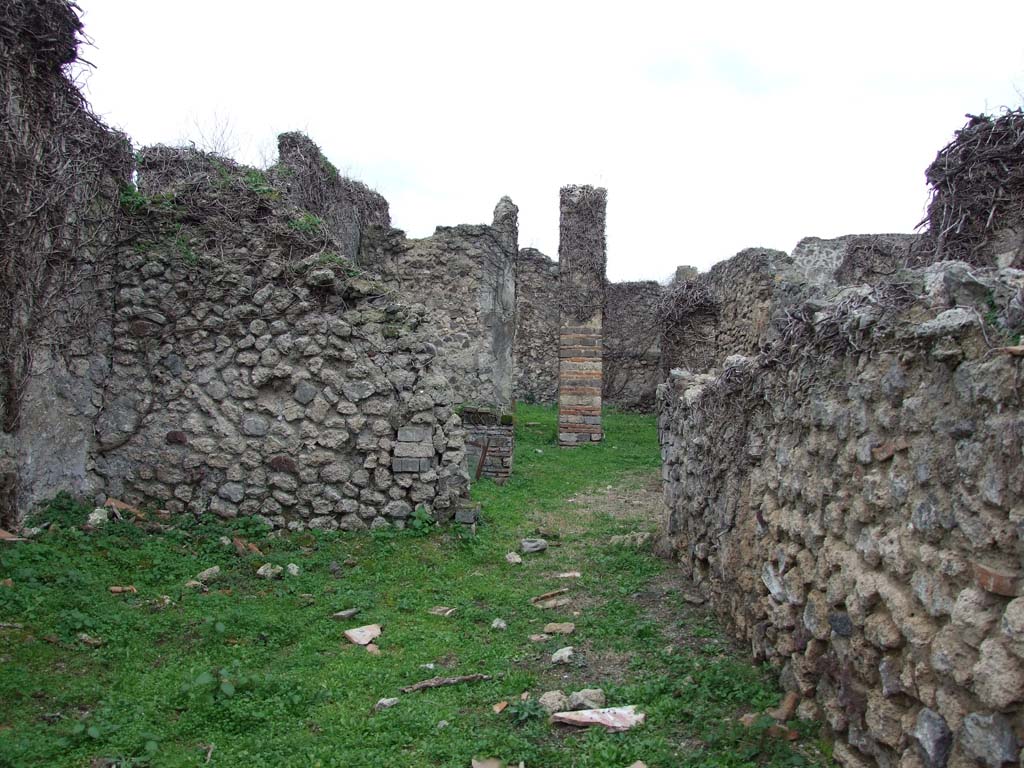 VI.16.10 Pompeii. December 2007. Doorway to atrium or corridor in rear wall of shop.
According to NdS, by an open space in the west wall one entered into a corridor with white walls and red horizontal band at the height of the dado.