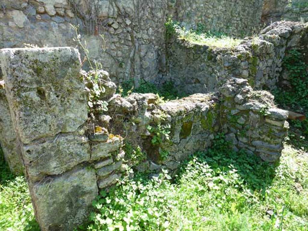 VI.16.11 Pompeii. May 2010. Looking south-west from yard towards wall with remains of window opening from cubiculum.  This window used to have a marble windowsill.