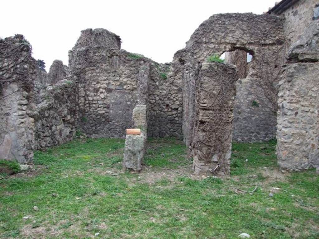 VI.16.13 Pompeii. December 2007. Doorways to three rooms on west side. According to NdS, the room on the left was a small room with opus signinum floor. It was lit by a circular window in the top of the west wall. At the foot of this same west wall, on the floor and also on the sidewalls, one could see the trace left by a very long rectangular form of wooden furniture, that occupied all the lower space from one wall to the other. The room in the centre was a type of small corridor, that received its light from a slit at the top of the west wall. The room on the right had a floor of cocciopesto  and walls faced with rough plaster.
In its western wall was a rectangular window and above it the holes for the beams that supported the upper room. Part of the upper room’s west wall still existed, a continuation of that of the room below, with the remains of the painted decoration, consisting of a panel with a white background, showing the representation of a sea-monster preserved by its serpentine tail, and some small dolphins. See Notizie degli Scavi di Antichità, 1908, (p.63)